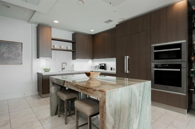 a kitchen with cabinets a sink and appliances