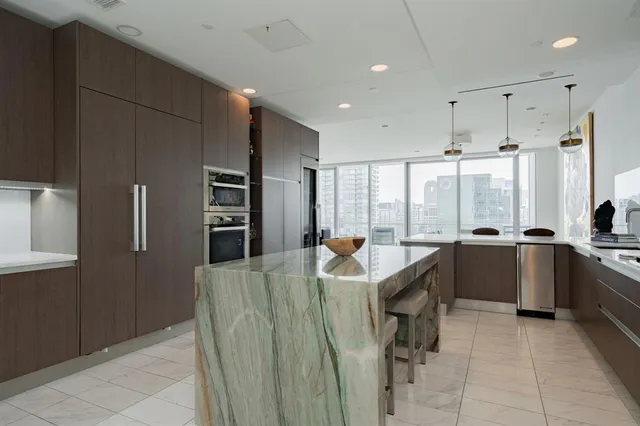 a very nice looking dining room with a large window
