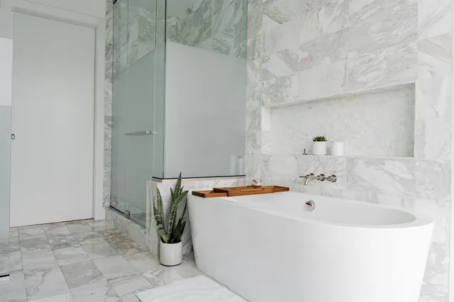 a bathroom with a tub and sink