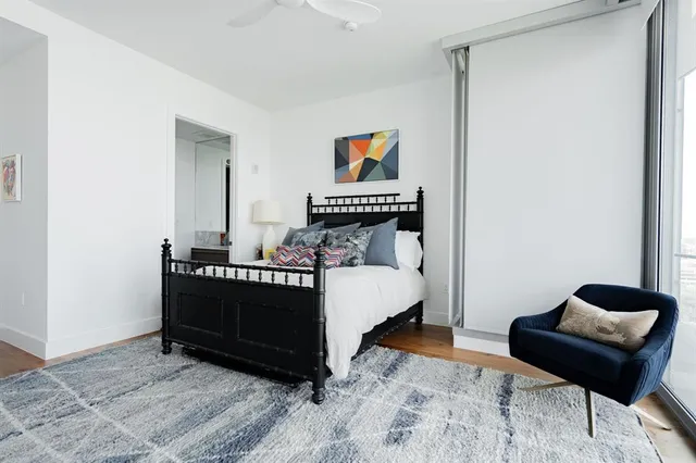 a bedroom with furniture and a window