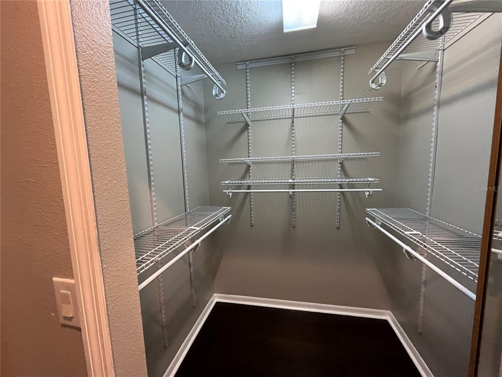 2533 Ridgewind Way Windermere, FL 34786 - Photo 21 of 33 a view of a room with racks on the wall