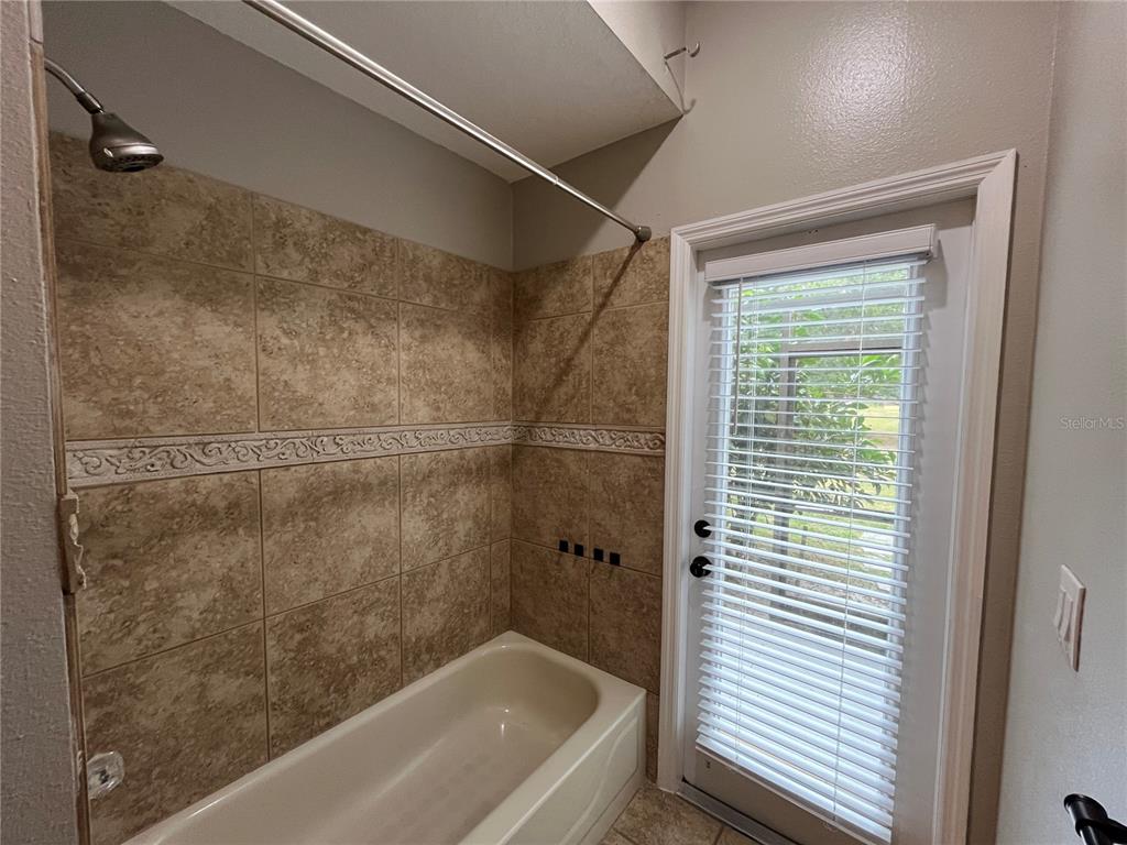 2533 Ridgewind Way Windermere, FL 34786 - Photo 25 of 33 a bathroom with a bathtub and shower