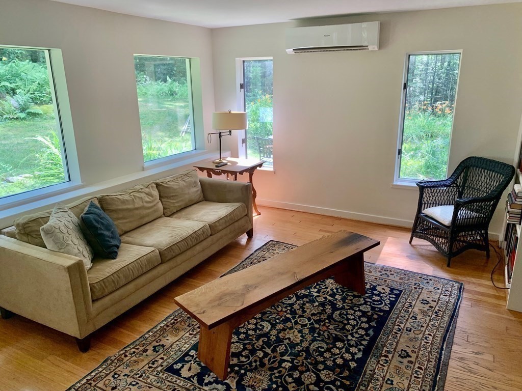 30 Butterhill Road Pelham, MA 01002 - Photo 4 of 39 a living room with furniture and a window