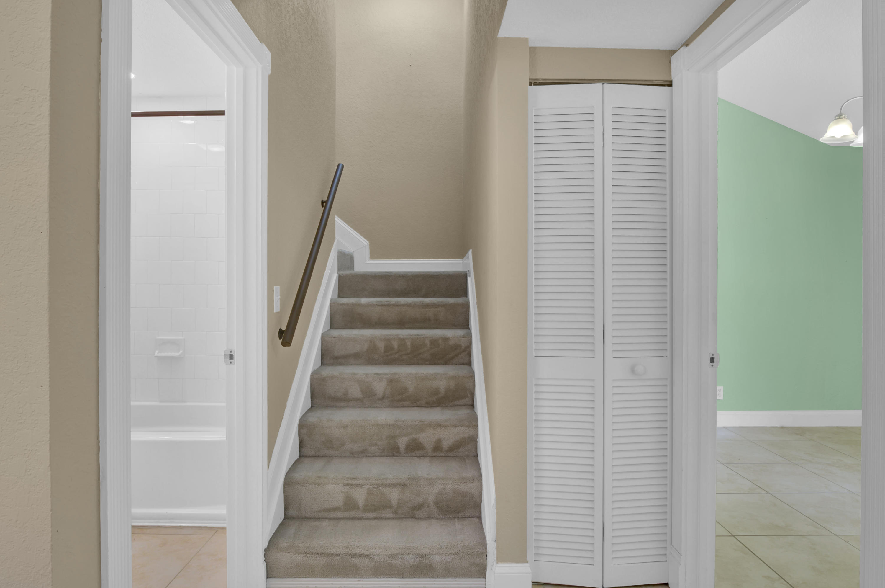 3765 Blue Ridge Road West Palm Beach, FL 33406 - Photo 14 of 15 a view of staircase with white walls and a window