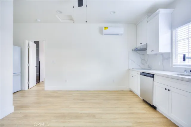 a view of a kitchen with a sink