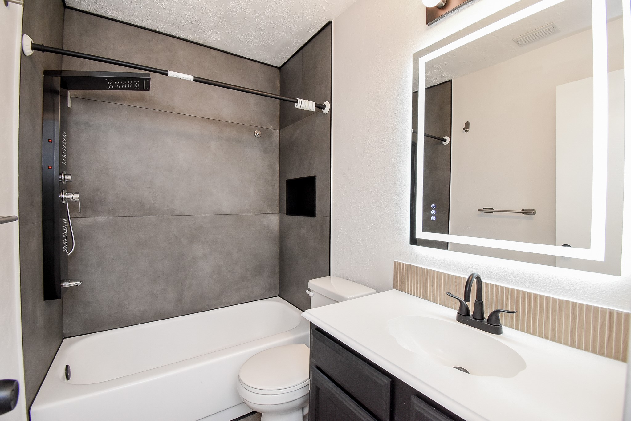 8715 Vinkins Road Houston, TX 77071 - Photo 36 of 48 Thoughtfully updated with contemporary finishes and fixtures, this spacious secondary bathroom provides comfort and convenience for the home's two secondary bedrooms