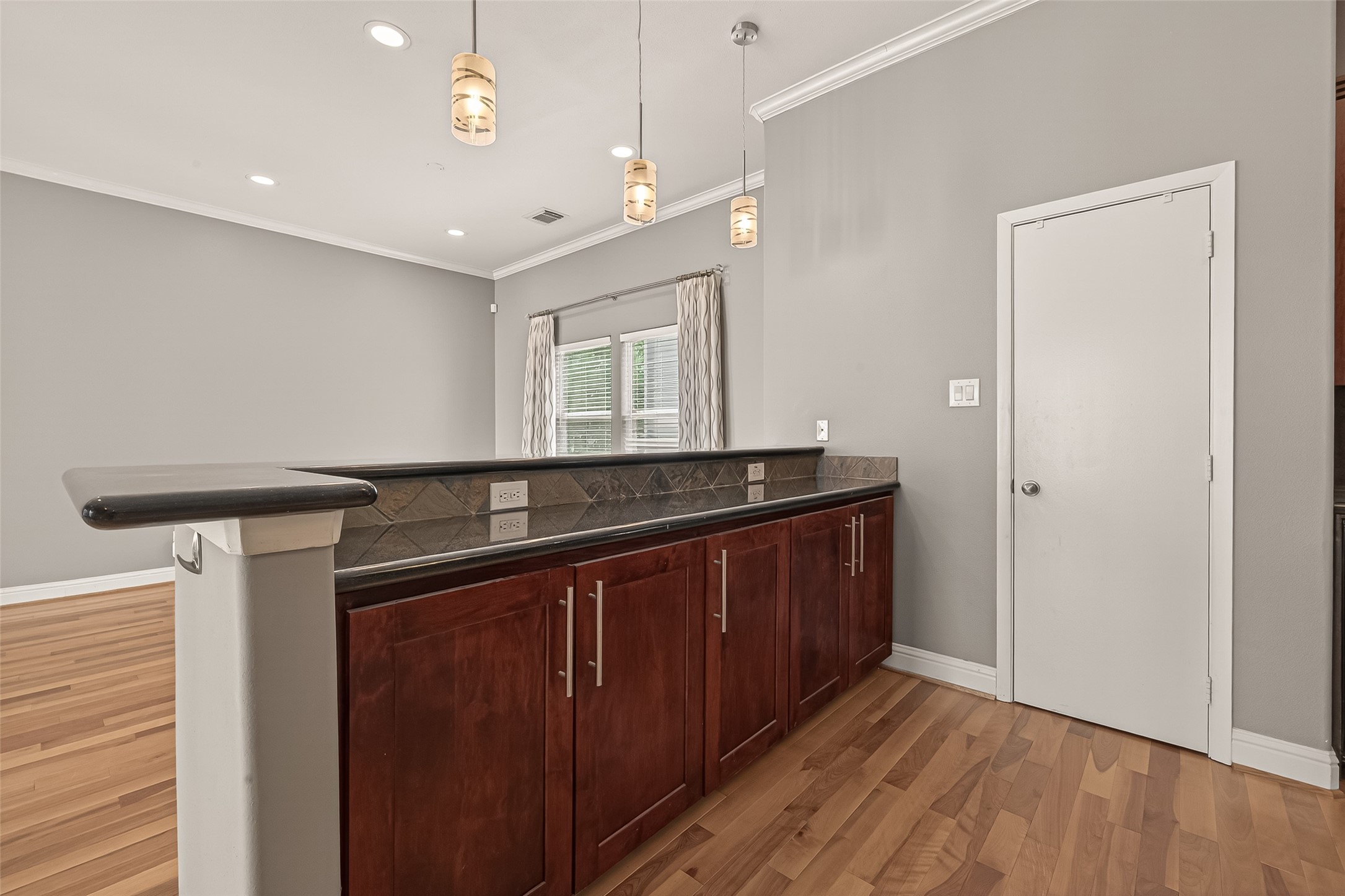 1107 St Charles Street Houston, TX 77003 - Photo 17 of 37 a kitchen with a sink and wooden floor