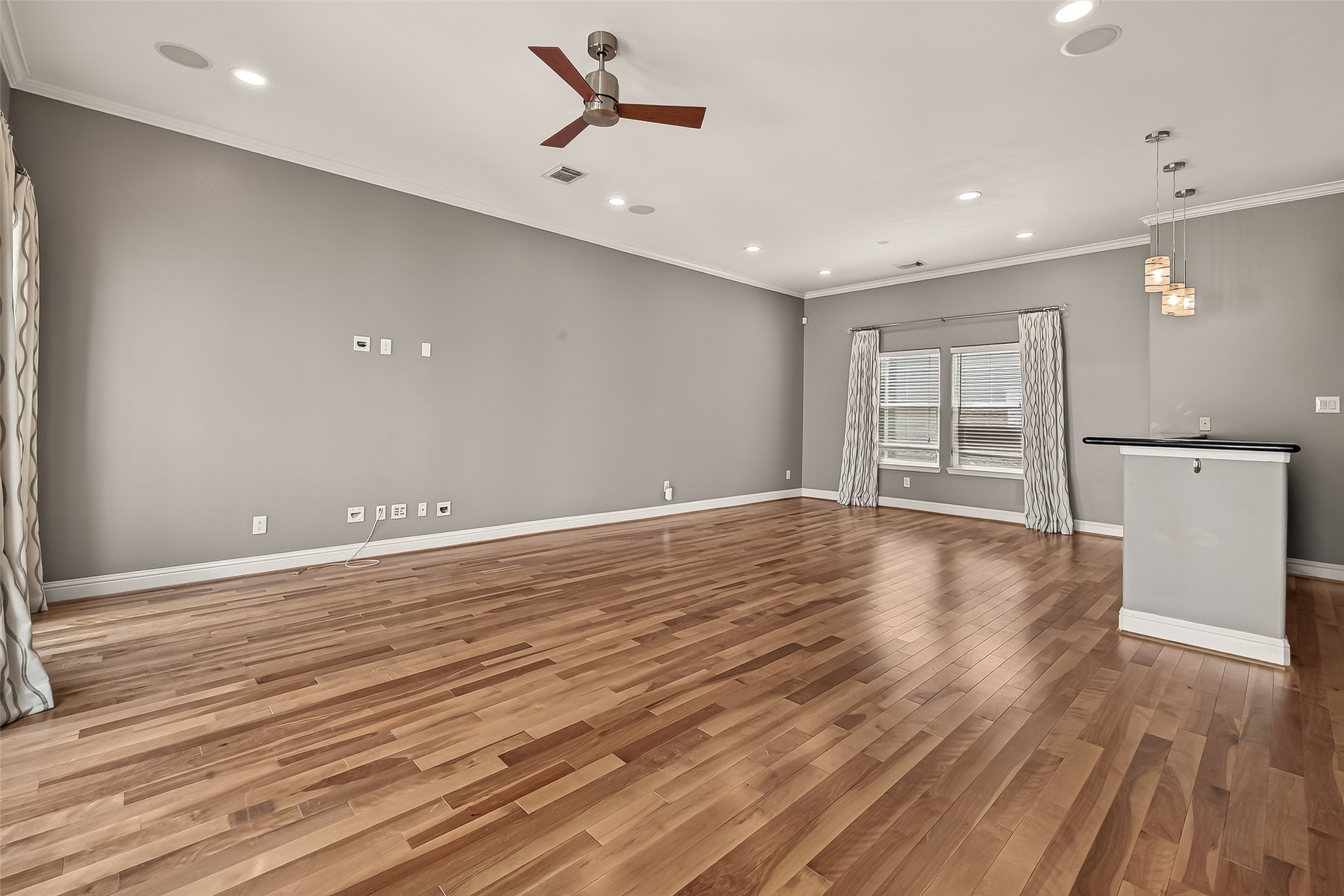 1107 St Charles Street Houston, TX 77003 - Photo 18 of 37 a view of a room with wooden floor and window