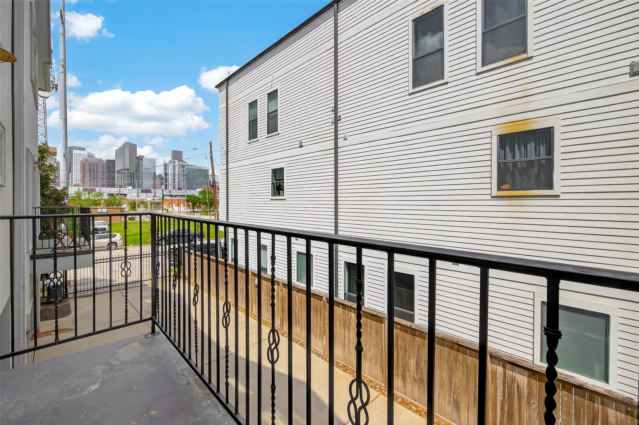 1107 St Charles Street Houston, TX 77003 - Photo 20 of 37 a view of a balcony with a small yard