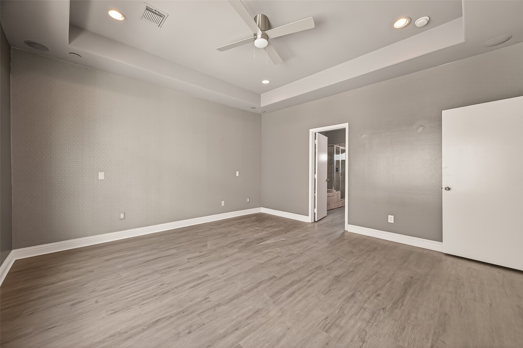 1107 St Charles Street Houston, TX 77003 - Photo 22 of 37 wooden floor in an empty room with a window