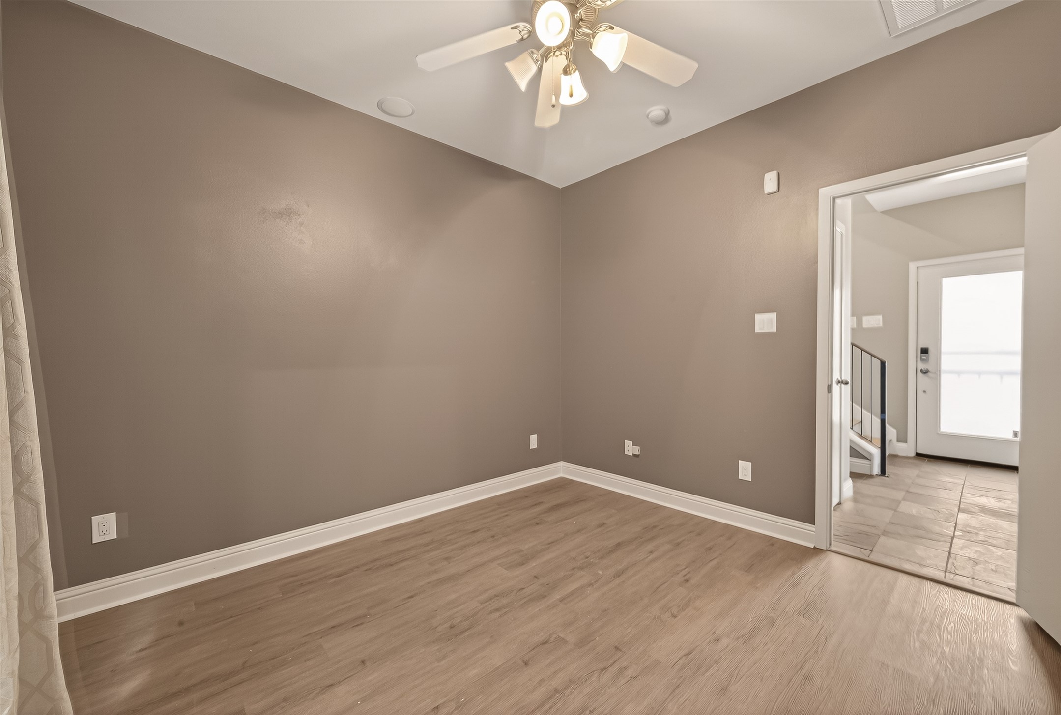 1107 St Charles Street Houston, TX 77003 - Photo 28 of 37 a view of an empty room with wooden floor