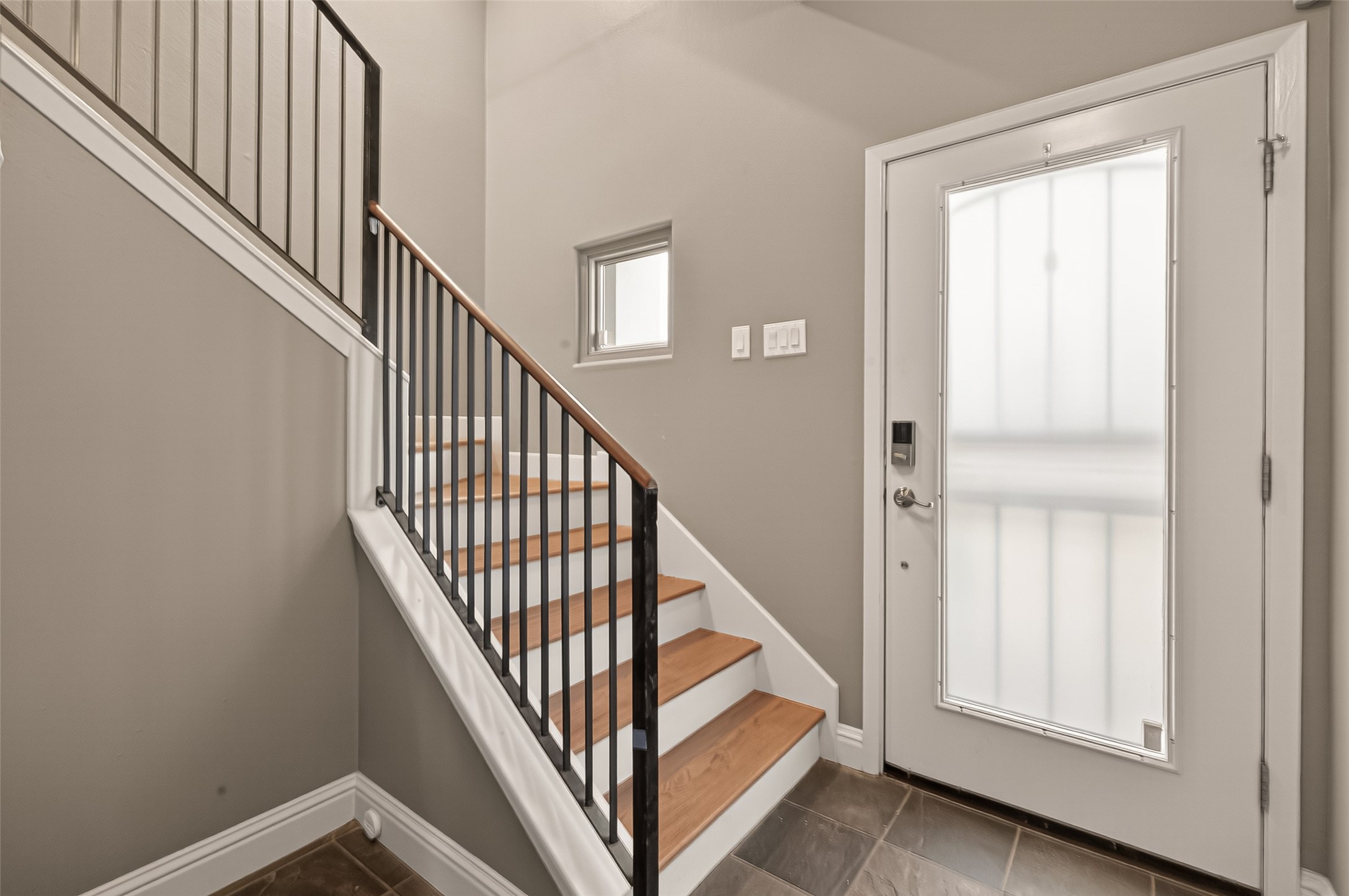 1107 St Charles Street Houston, TX 77003 - Photo 3 of 37 a view of staircase with railing and white walls