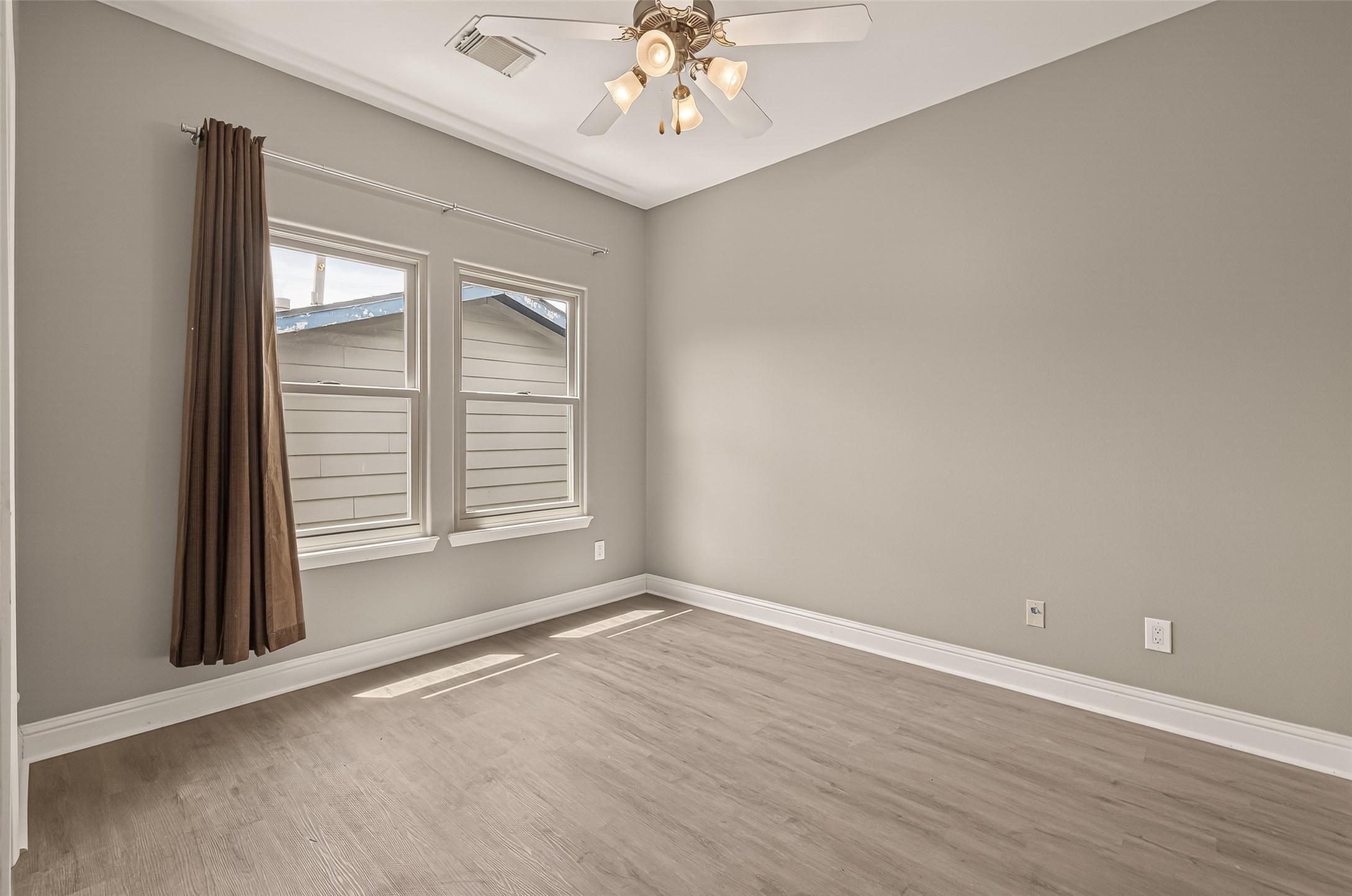 1107 St Charles Street Houston, TX 77003 - Photo 4 of 37 a view of an empty room with a window