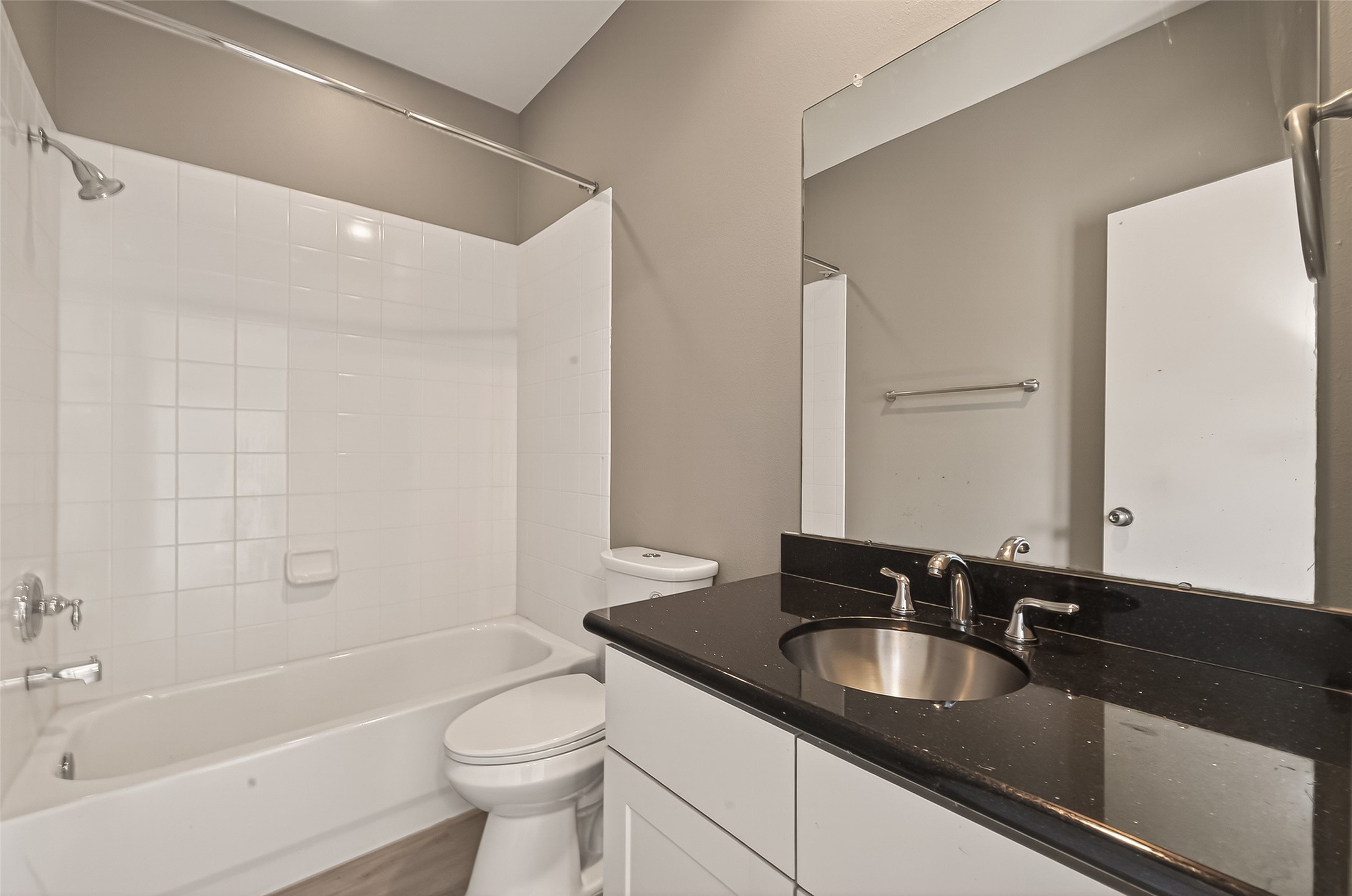 1107 St Charles Street Houston, TX 77003 - Photo 7 of 37 a bathroom with a granite countertop sink toilet and shower