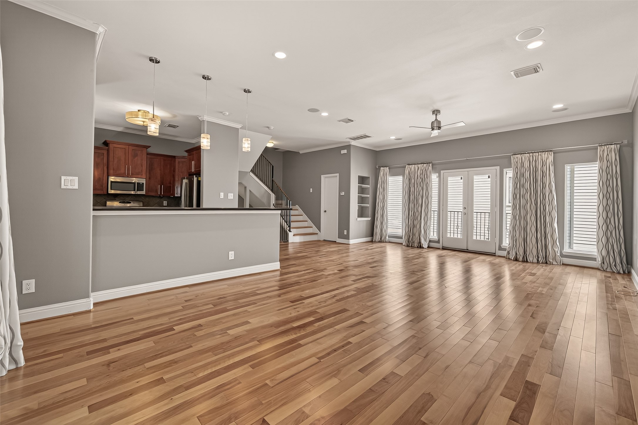 1107 St Charles Street Houston, TX 77003 - Photo 10 of 37 a view of a kitchen with a wooden floor