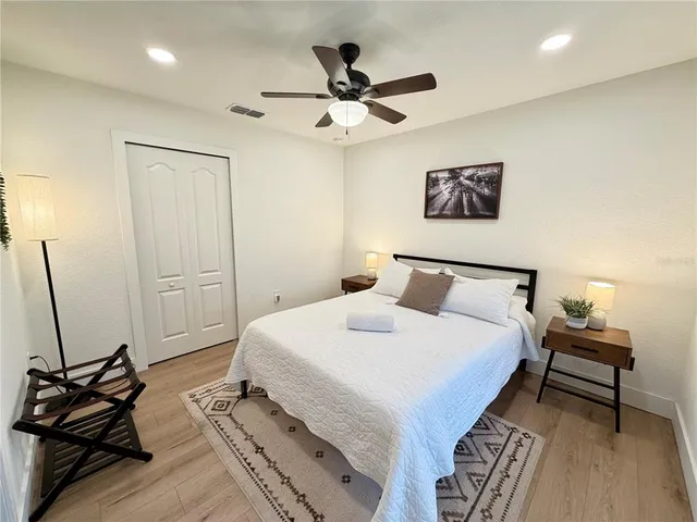 a bedroom with a bed and a dresser