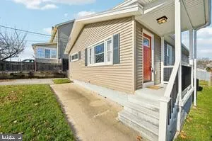 a view of house with yard