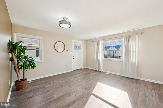 a view of livingroom with wooden floor and window