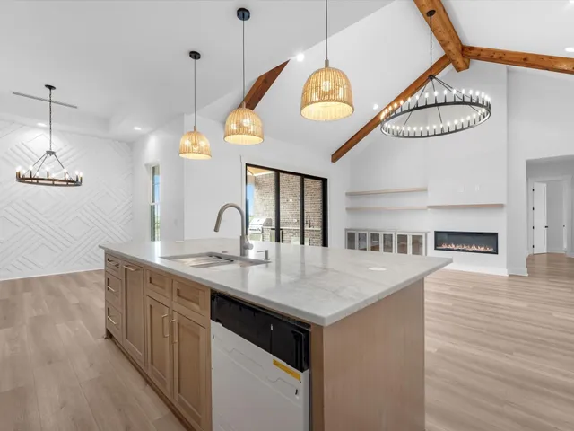 a view of a kitchen counter space a sink and appliances