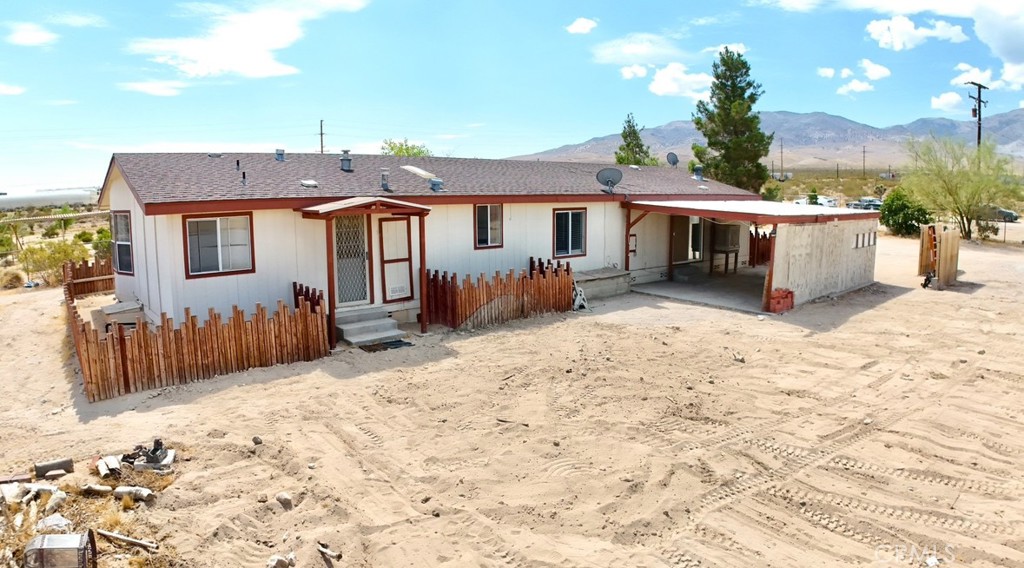 8130 Camp Rock Road Lucerne Valley, CA 92356 - Photo 3 of 14 a view of a house with wooden roof and covered with snow