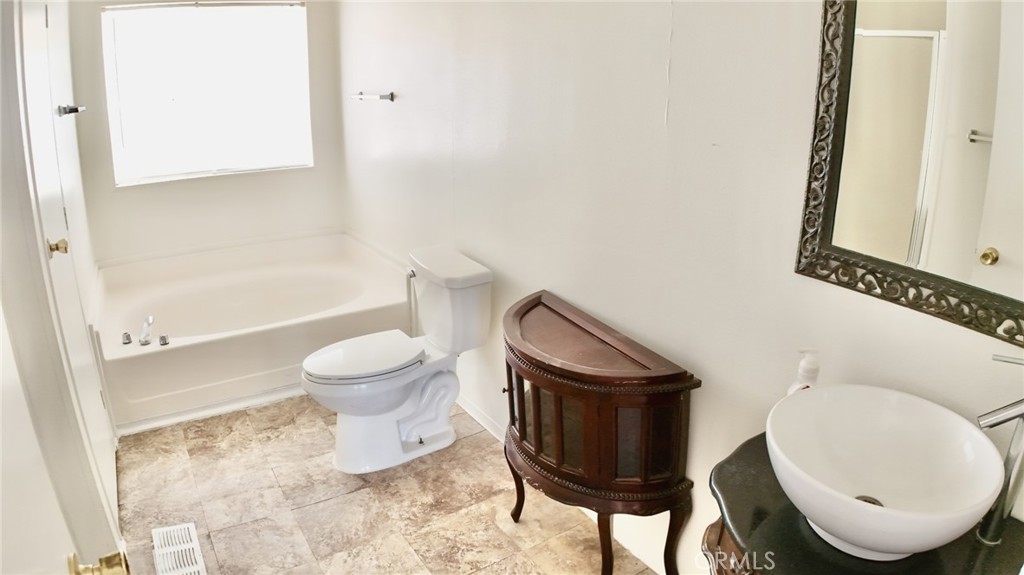 8130 Camp Rock Road Lucerne Valley, CA 92356 - Photo 10 of 14 a bathroom with a toilet and a mirror
