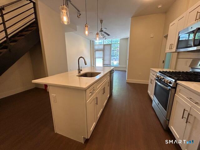 111 Morgan Street, Unit TH5 Stamford, CT 06905 - Photo 10 of 23 a kitchen with stainless steel appliances a sink stove and refrigerator