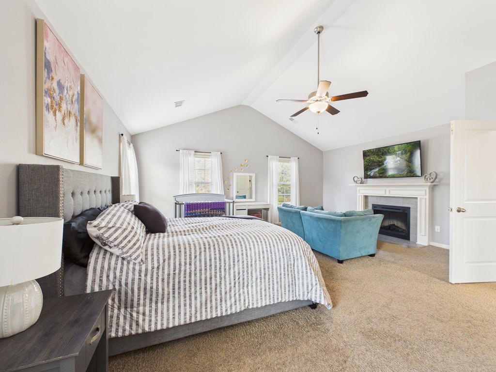 783 Sweetbay Parkway Hamilton, GA 31811 - Photo 18 of 46 a bedroom with furniture and a fireplace