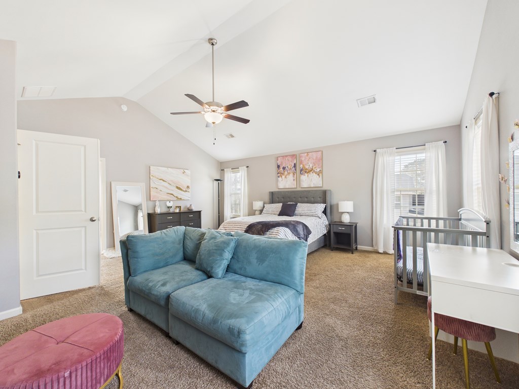 783 Sweetbay Parkway Hamilton, GA 31811 - Photo 20 of 46 a living room with furniture a chandelier and a dining table