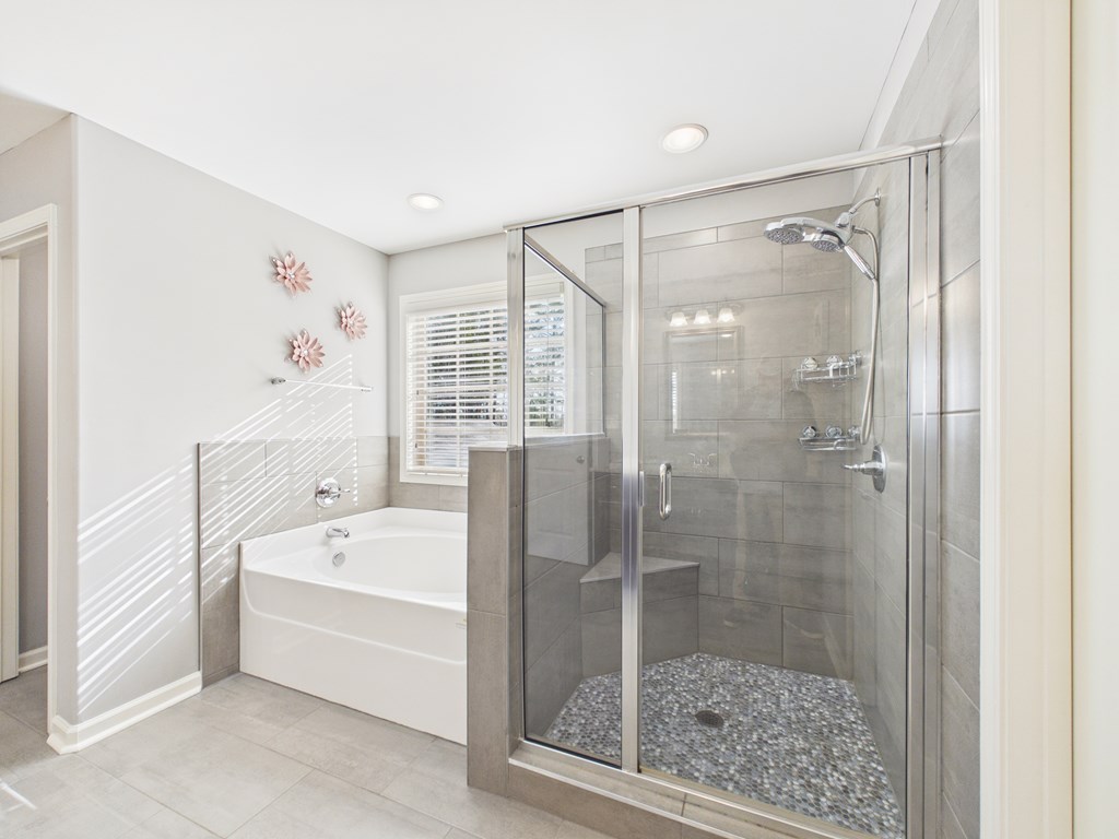 783 Sweetbay Parkway Hamilton, GA 31811 - Photo 22 of 46 a bathroom with a bathtub and a shower