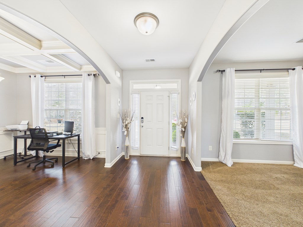 783 Sweetbay Parkway Hamilton, GA 31811 - Photo 3 of 46 an empty room with wooden floor and windows