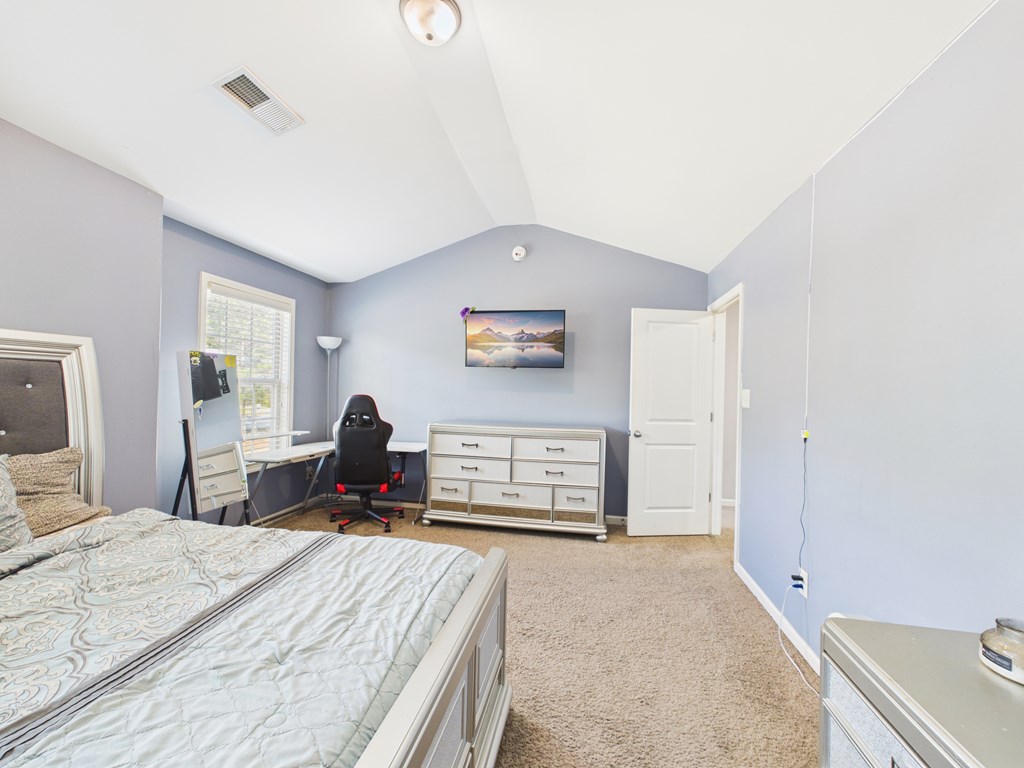 783 Sweetbay Parkway Hamilton, GA 31811 - Photo 35 of 46 a bedroom with a bed and a large mirror