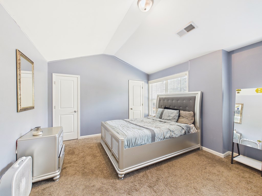 783 Sweetbay Parkway Hamilton, GA 31811 - Photo 36 of 46 a bedroom with a bed and a couch