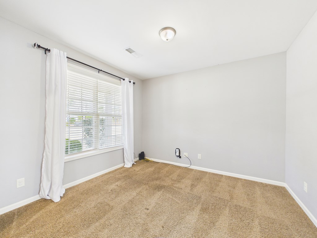 783 Sweetbay Parkway Hamilton, GA 31811 - Photo 5 of 46 a view of an empty room with a window