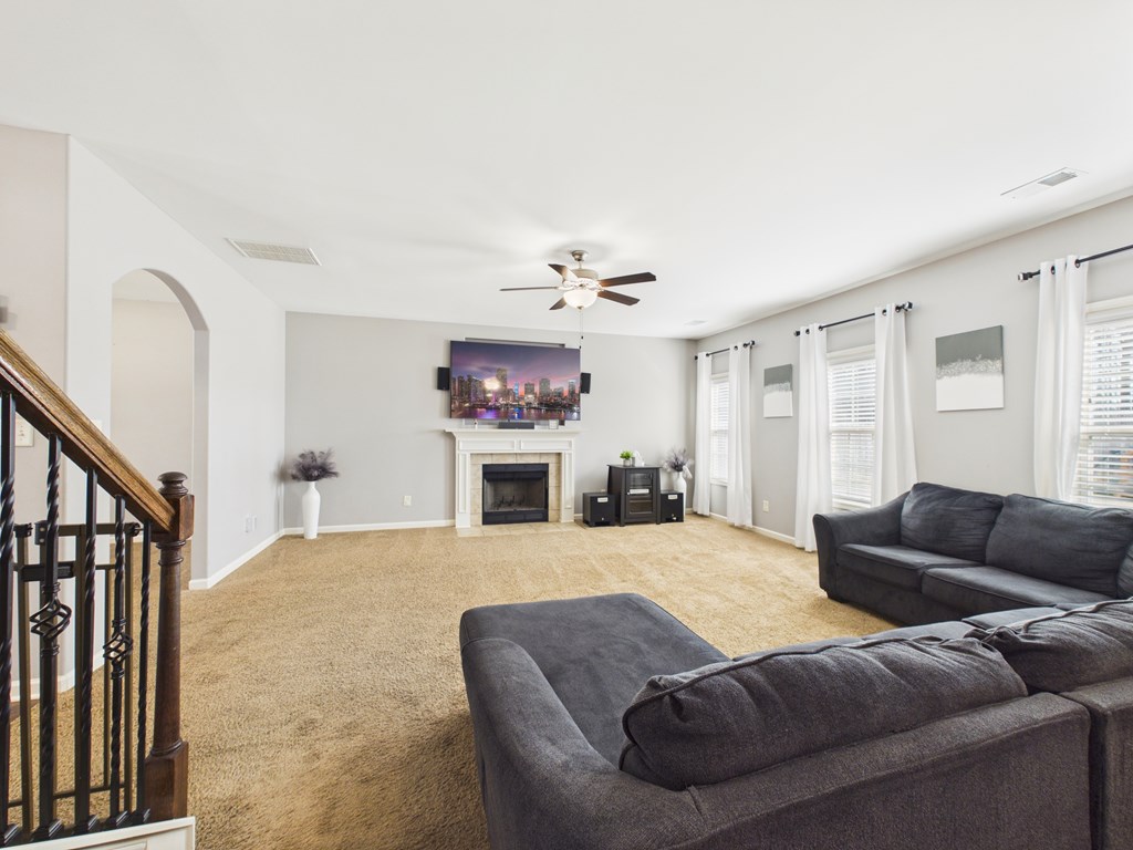 783 Sweetbay Parkway Hamilton, GA 31811 - Photo 10 of 46 a living room with furniture and a fireplace