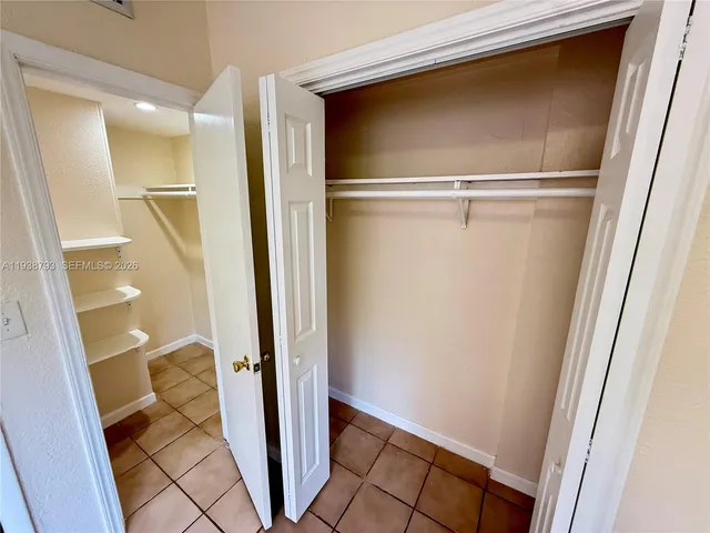 a bathroom with a glass door shower