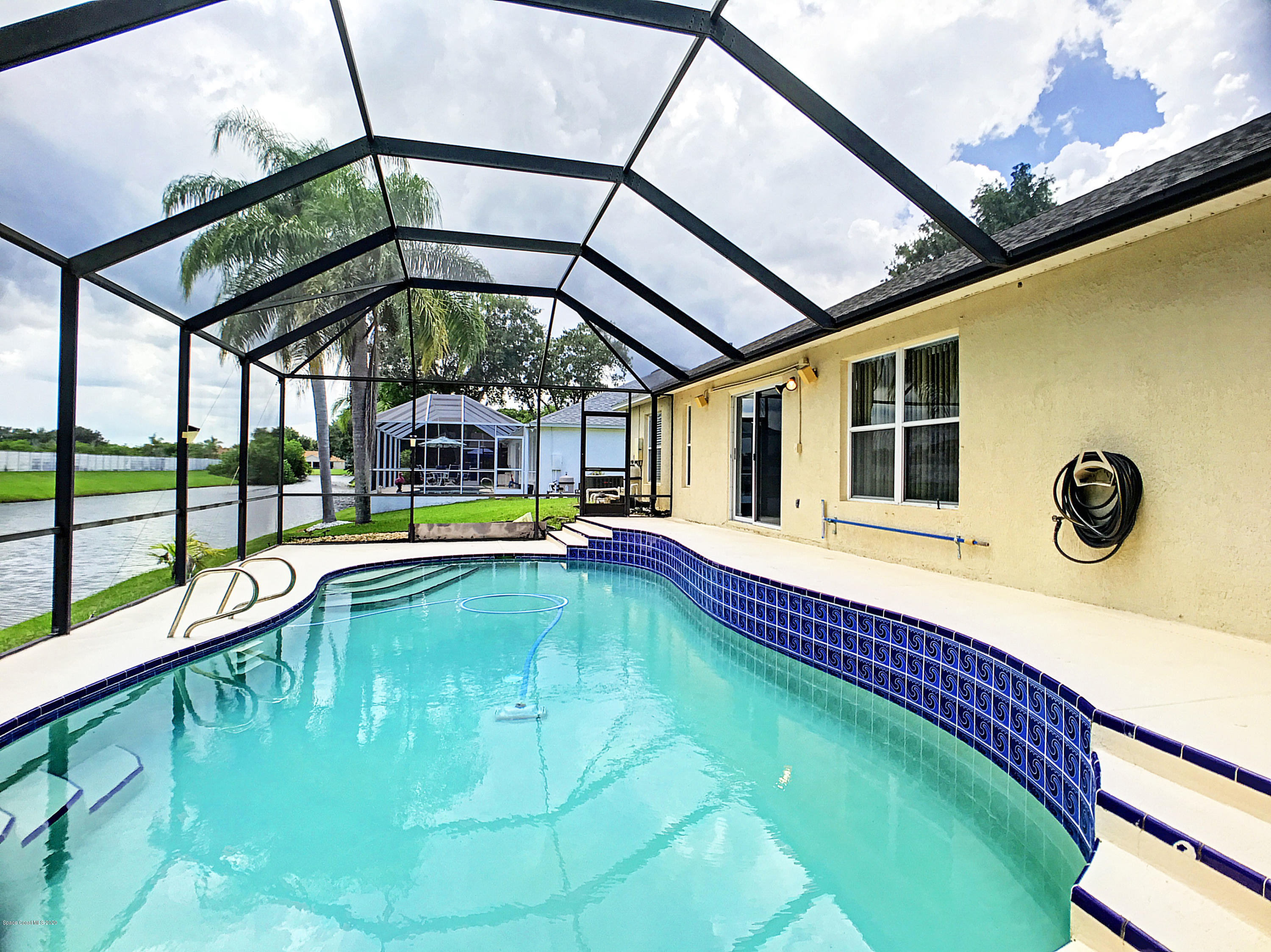 1253 Winding Meadows Road Rockledge, FL 32955 - Photo 2 of 29 pool and canal
