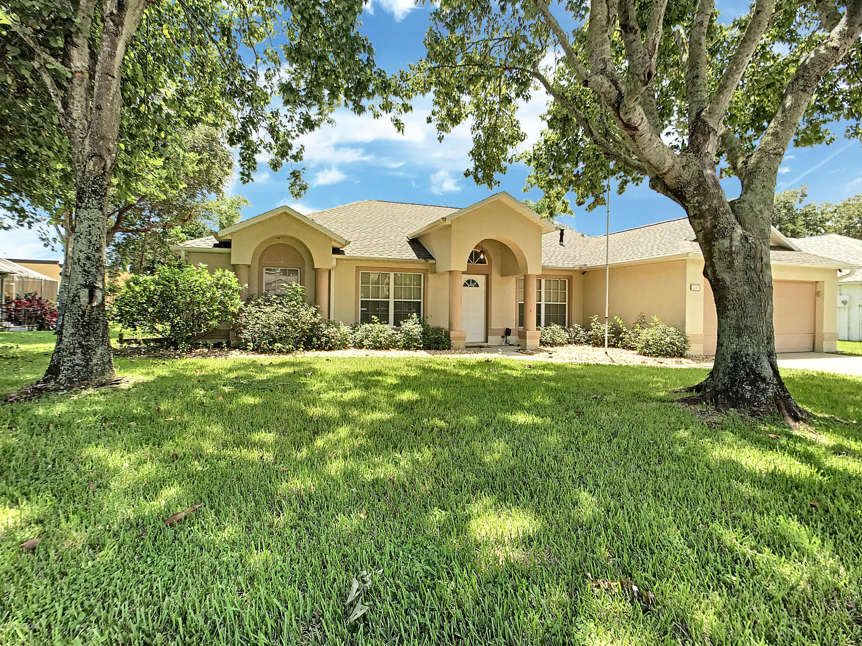 1253 Winding Meadows Road Rockledge, FL 32955 - Photo 27 of 29 windingMeadowsfrontnewsky copy