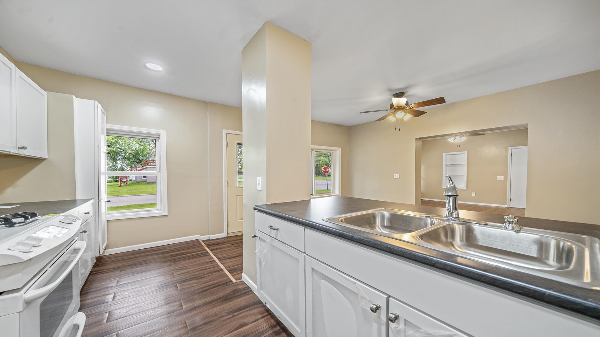 1122 1st Avenue Rochelle, IL 61068 - Photo 8 of 28 a kitchen with stainless steel appliances granite countertop a sink and a refrigerator