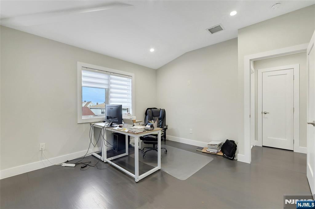 229 6th Street, Unit A Fairview, NJ 07022 - Photo 23 of 35 a view of a workspace with furniture and a window