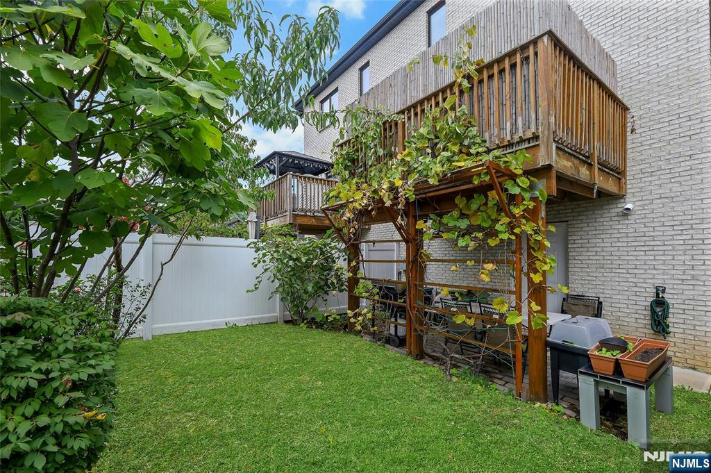 229 6th Street, Unit A Fairview, NJ 07022 - Photo 33 of 35 a backyard of a house with lots of green space