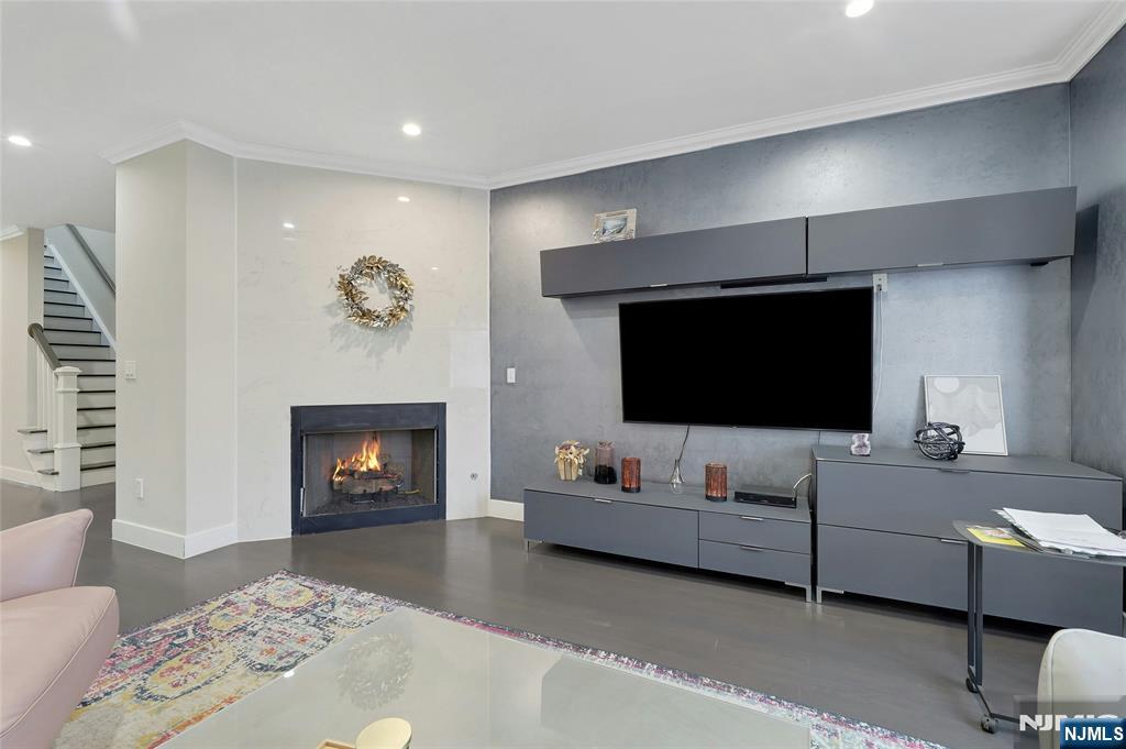 229 6th Street, Unit A Fairview, NJ 07022 - Photo 6 of 35 a living room with furniture and a flat screen tv