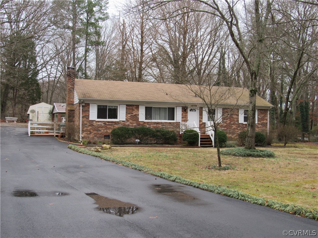 10009 Wycliff Road Chesterfield, VA 23236 - Photo 1 of 24 a front view of a house with a yard