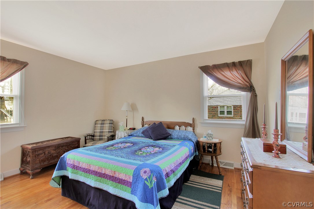 10009 Wycliff Road Chesterfield, VA 23236 - Photo 12 of 24 a bedroom with a bed and a dresser next to a window