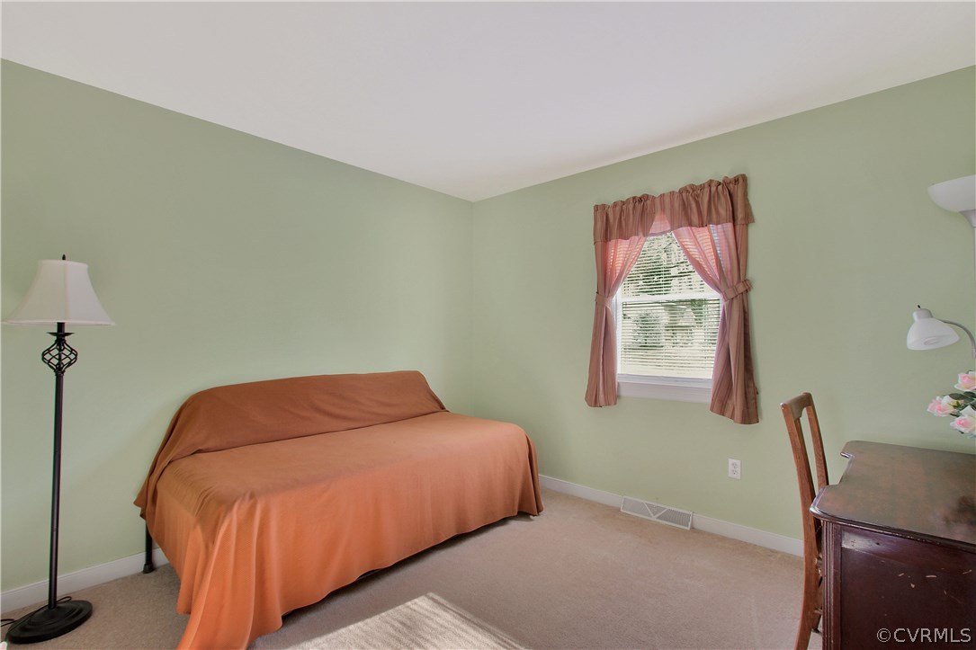 10009 Wycliff Road Chesterfield, VA 23236 - Photo 15 of 24 a bedroom with a bed and a desk