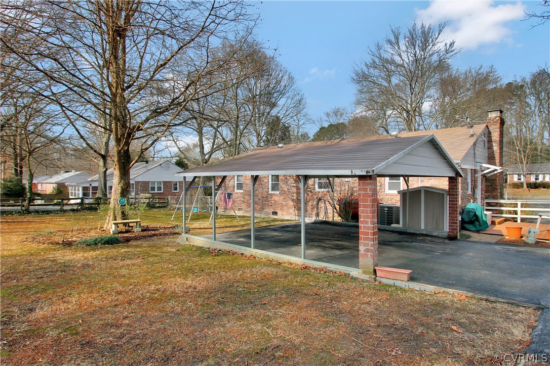 10009 Wycliff Road Chesterfield, VA 23236 - Photo 23 of 24 a view of a white house with a large pool and sitting area
