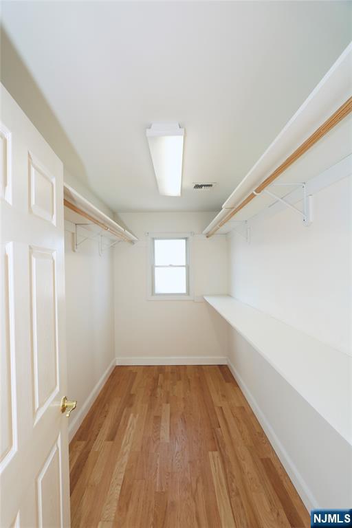 23 Main Avenue Wallington, NJ 07057 - Photo 20 of 29 a view of empty room with wooden floor and fan