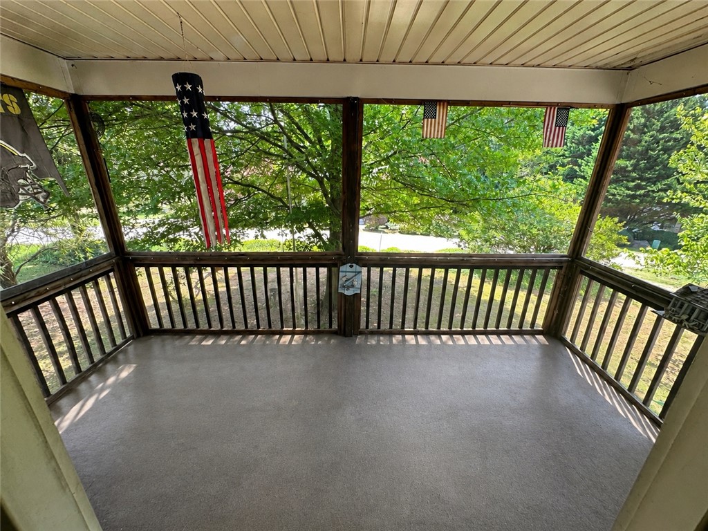 138 Cloverdale Road Seneca, SC 29678 - Photo 26 of 27 A screened porch with a wooded view provides a serene outdoor retreat.