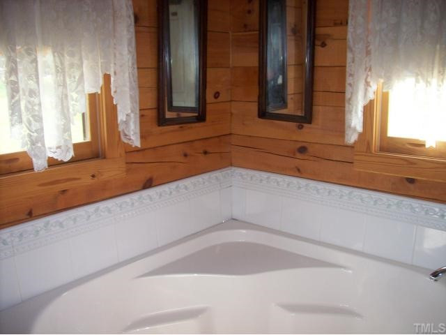 493 McGee Road Benson, NC 27504 - Photo 9 of 12 Imagine the oodles of bubbles, soft candlelight and beautiful surroundings. If you are more rushed for time, there is also a separate shower. Master Bath/Spa
