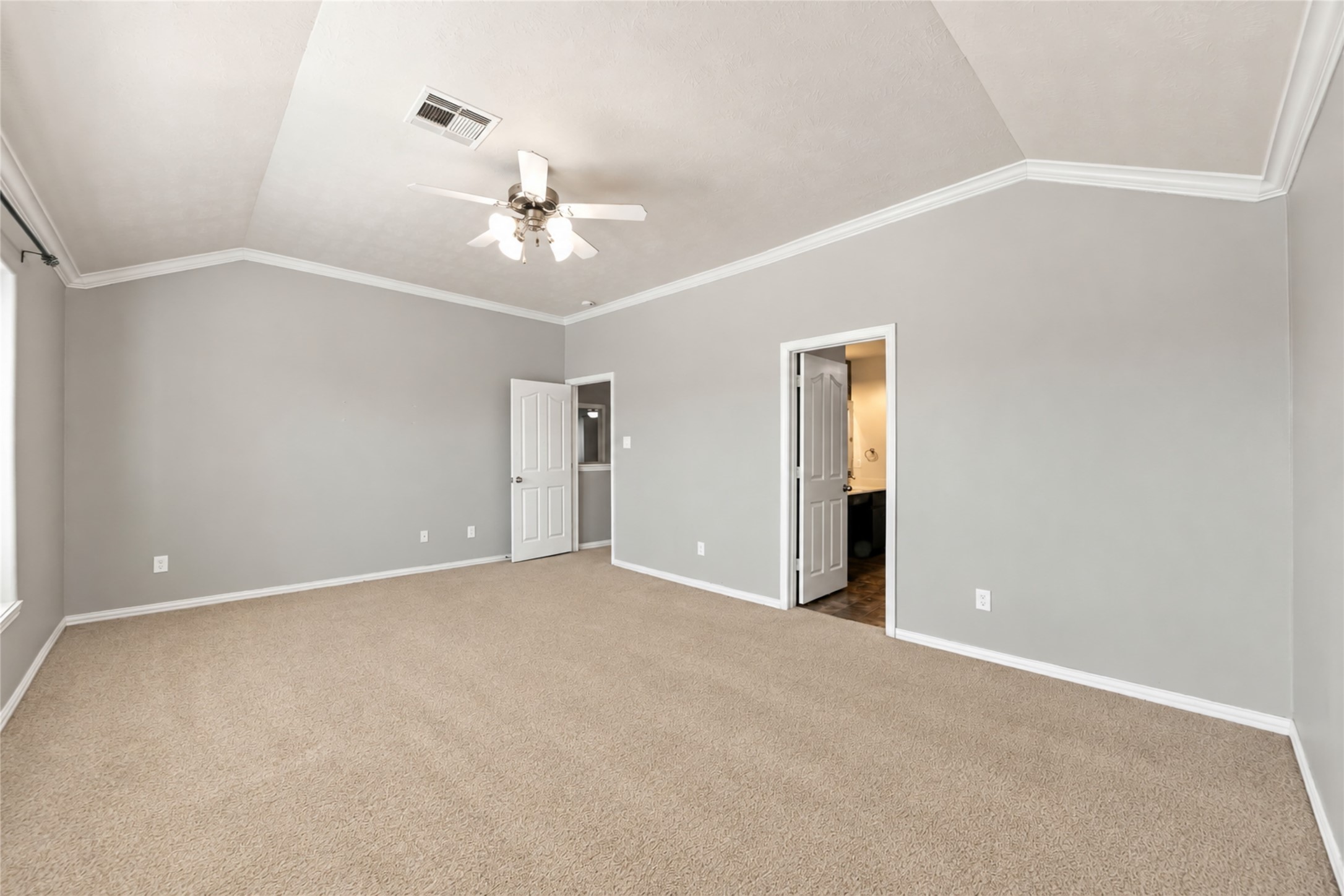 8338 Rudy Brook Way Spring, TX 77379 - Photo 19 of 33 Another view of the primary suite highlights its generous proportions and flexible furniture placement.