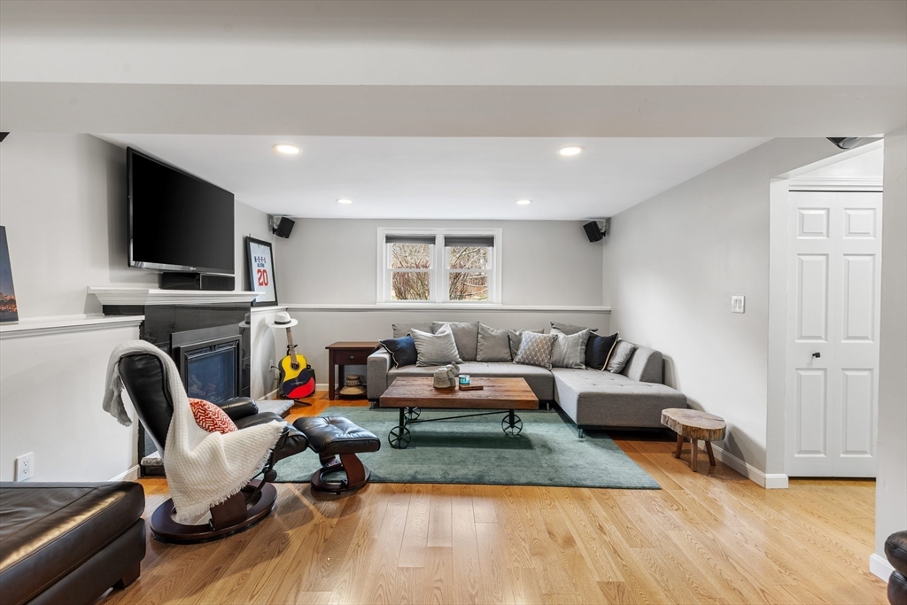 16 Bear Hill Road Billerica, MA 01821 - Photo 16 of 28 a living room with furniture and a flat screen tv